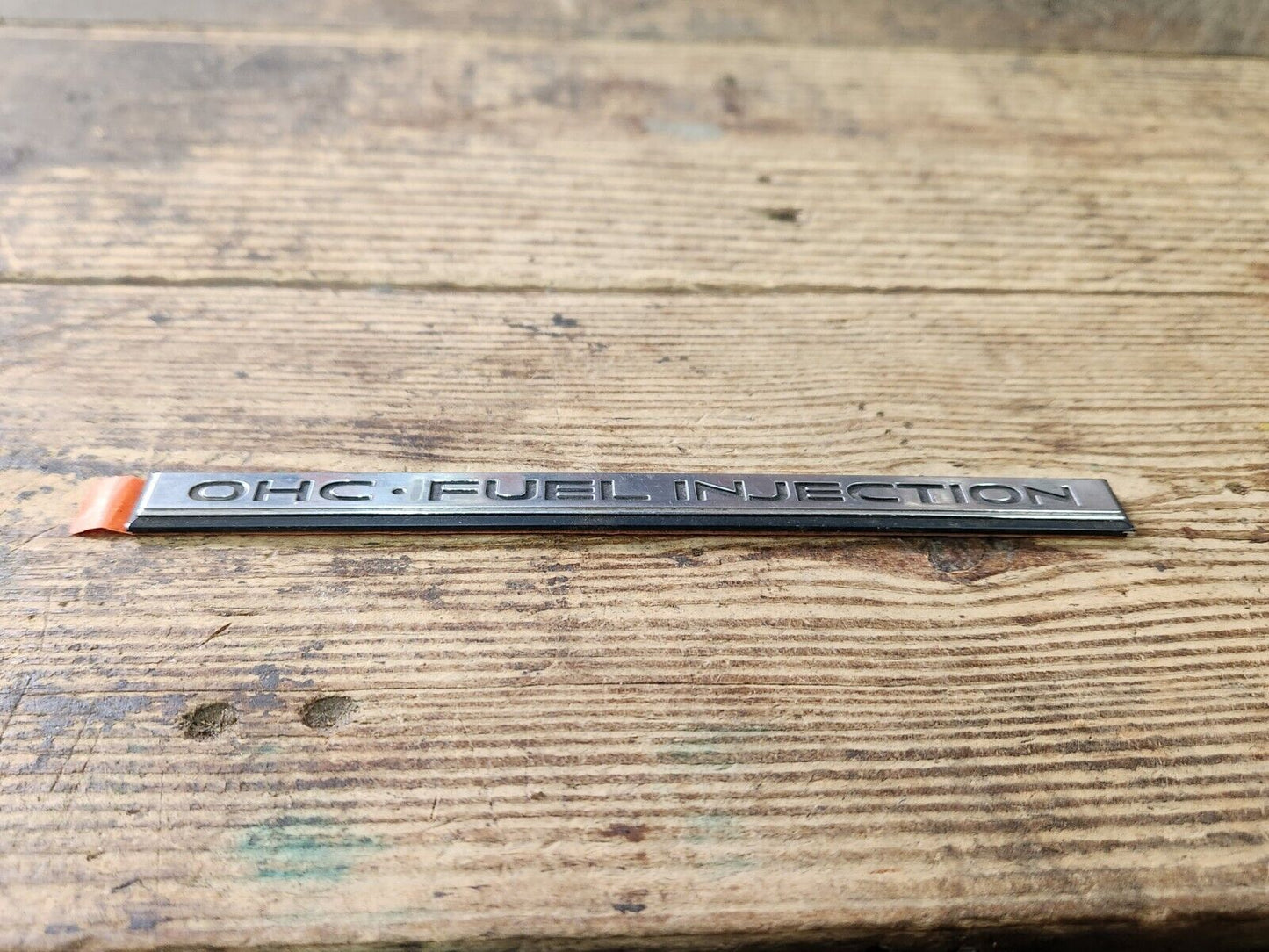 NOS NEW PONTIAC OHC FUEL INJECTION NAME PLATE ORNAMENT EMBLEM ORIGINAL FACTORY