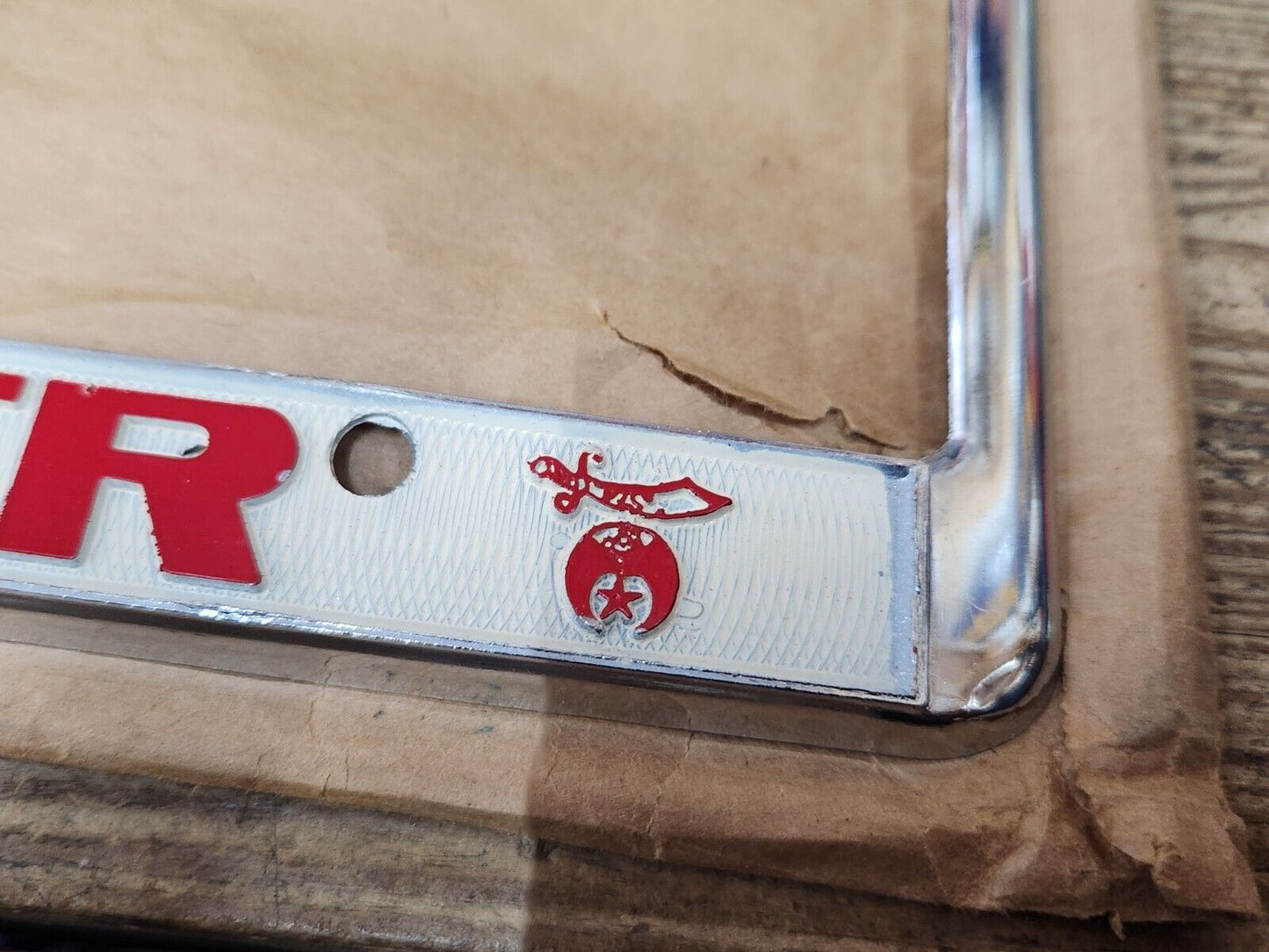 NEW NOS Vintage PROUD TO BE A SHRINER Metal Chrome Embossed License Plate Frame