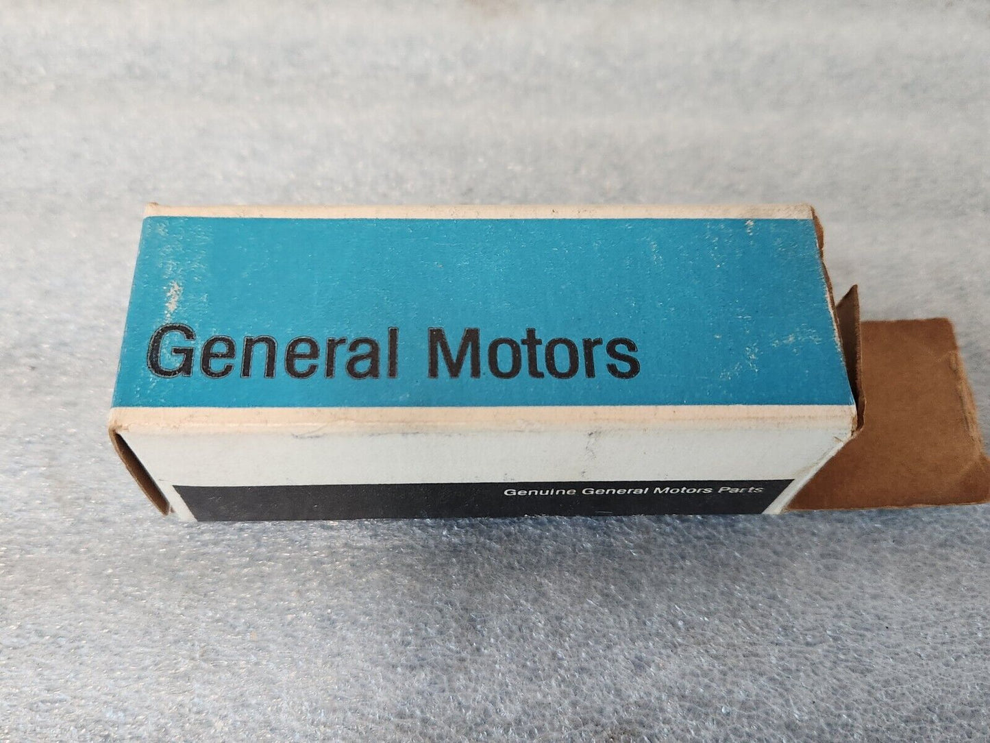 NOS OEM GM 1973-77 Vega Header rear Body Panel Nameplate Emblem 1700895 9633779