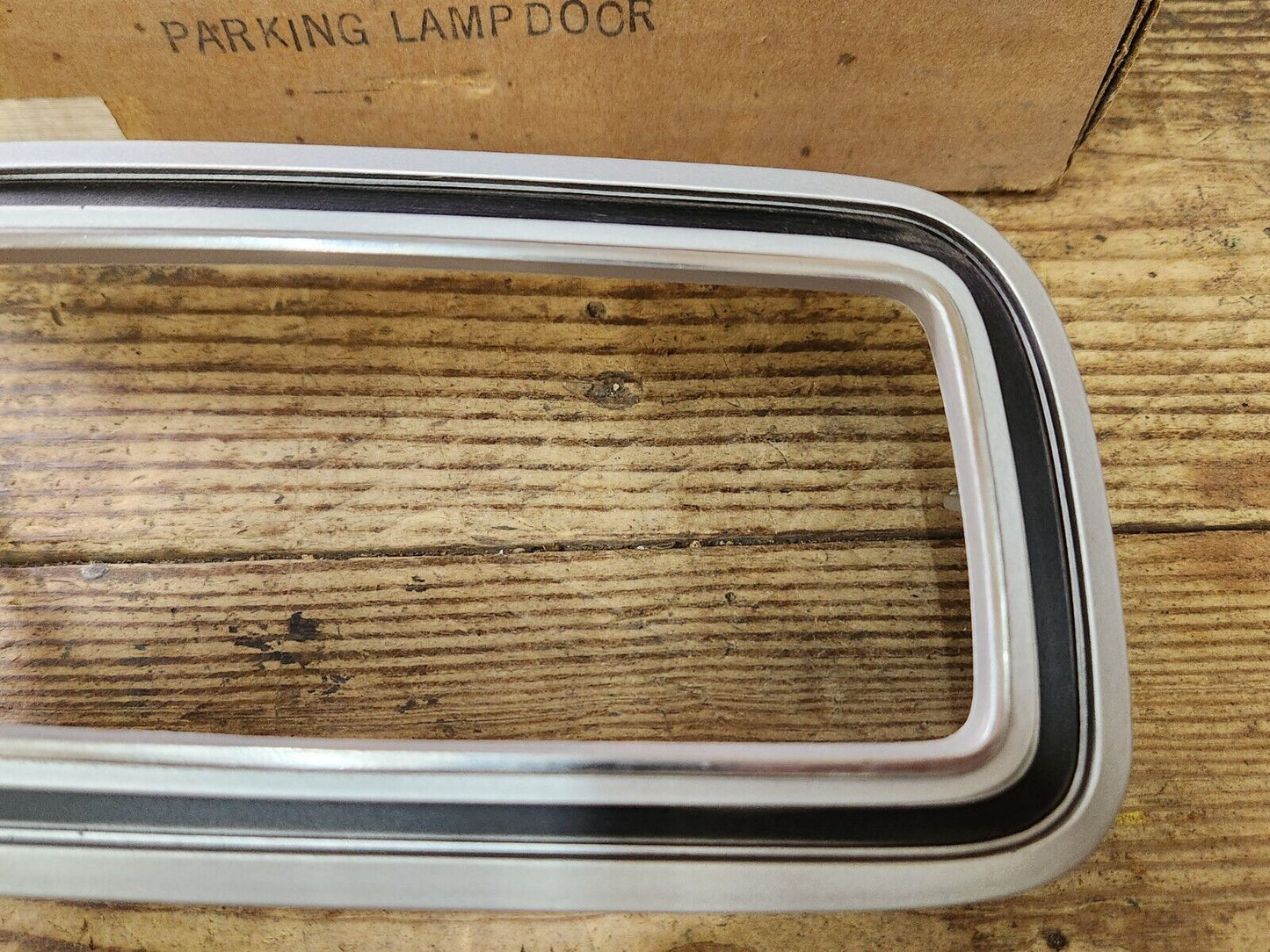 NOS OEM 1976 Ford Maverick Right Hand Parking Lamp Door Bezel D6DZ-13210-A