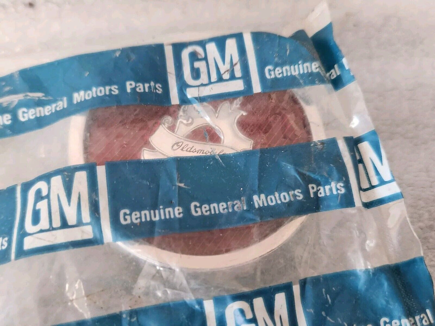 NOS OEM GM Pair (2) 1982-1987 Olds Cutlass Wire Wheel Lock Cover Emblem 22520008